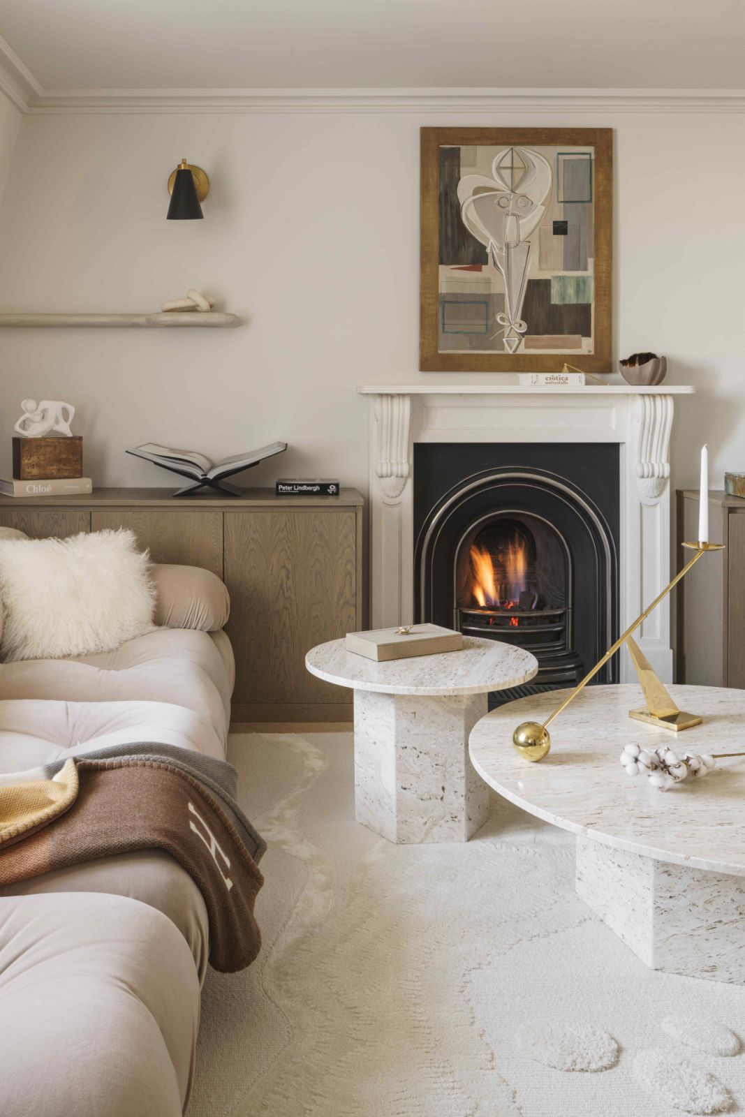 Marble tables complement the Victorian fireplace