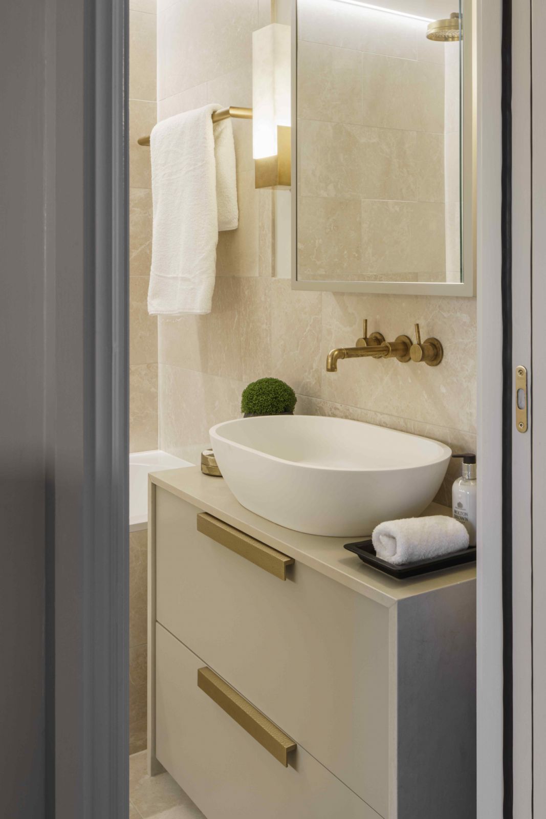 Mandarin stone frames the bathroom