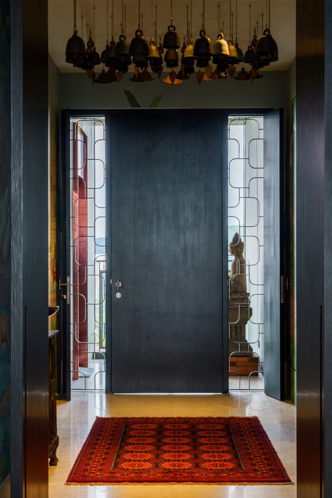 The lift opens to a serene image of Buddha - a seated stone statue of nearly 3 feet in height