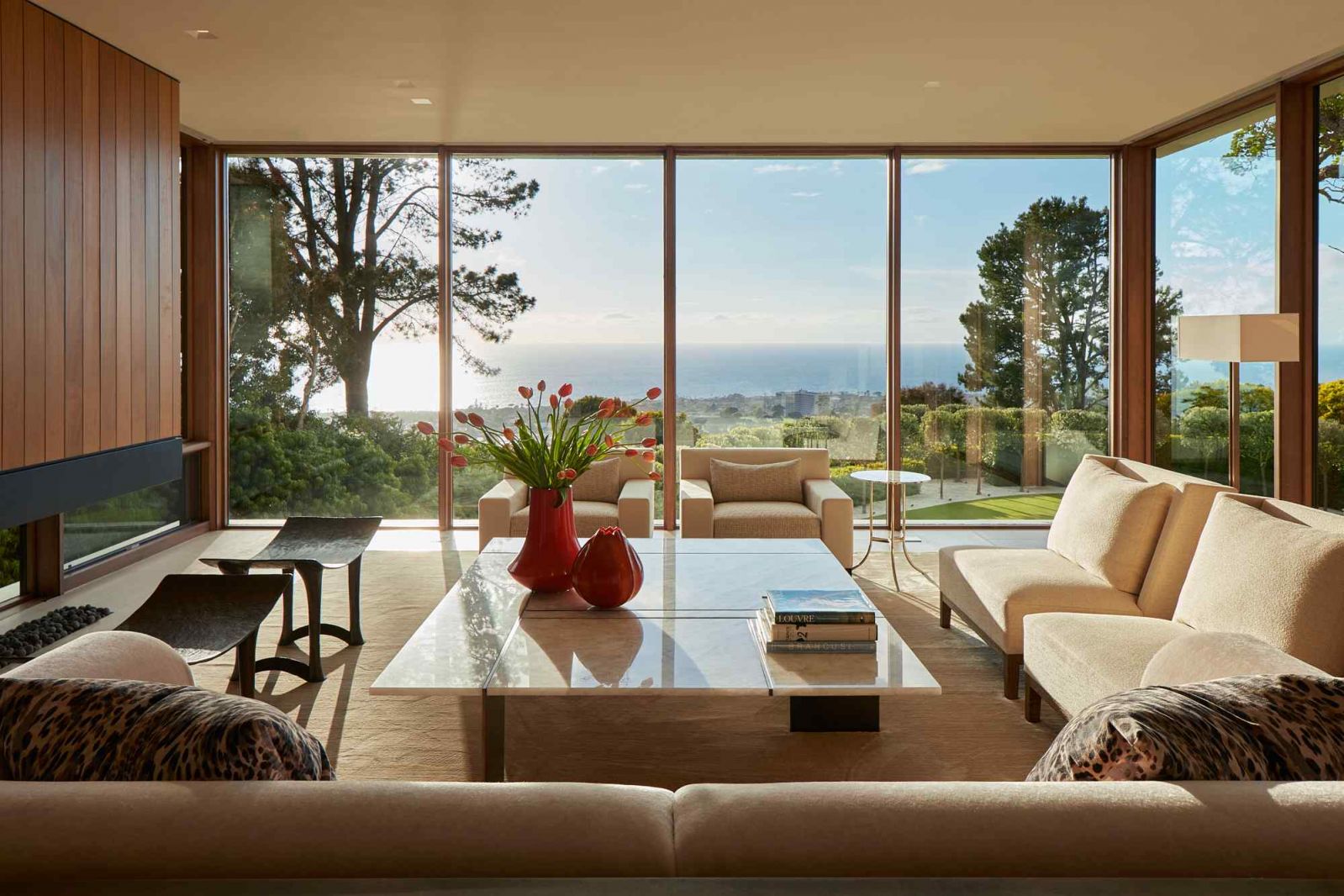The living room boasts wrap-around views of the Pacific Ocean