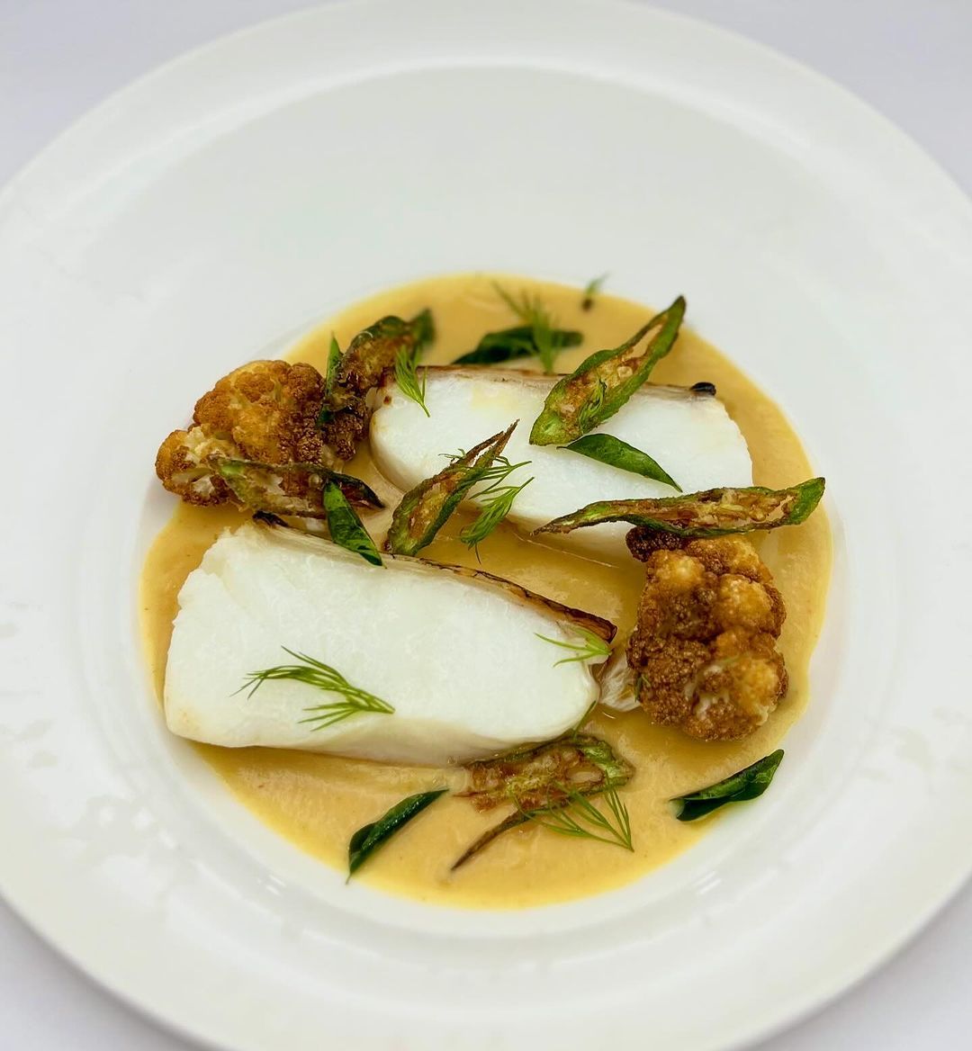 Shio Koji-aged cod with Japanese curry powder-spiced cauliflower sauce (Photo: Instagram / @sage.restaurantandwinebar)