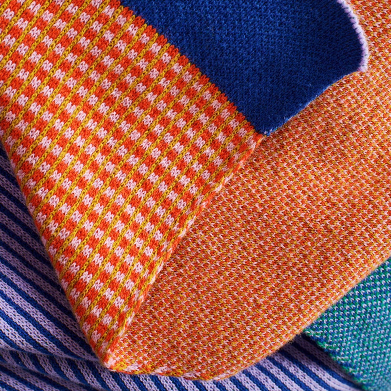 Graphic lines and solid colours of the Ikea Tesammans knitted throw