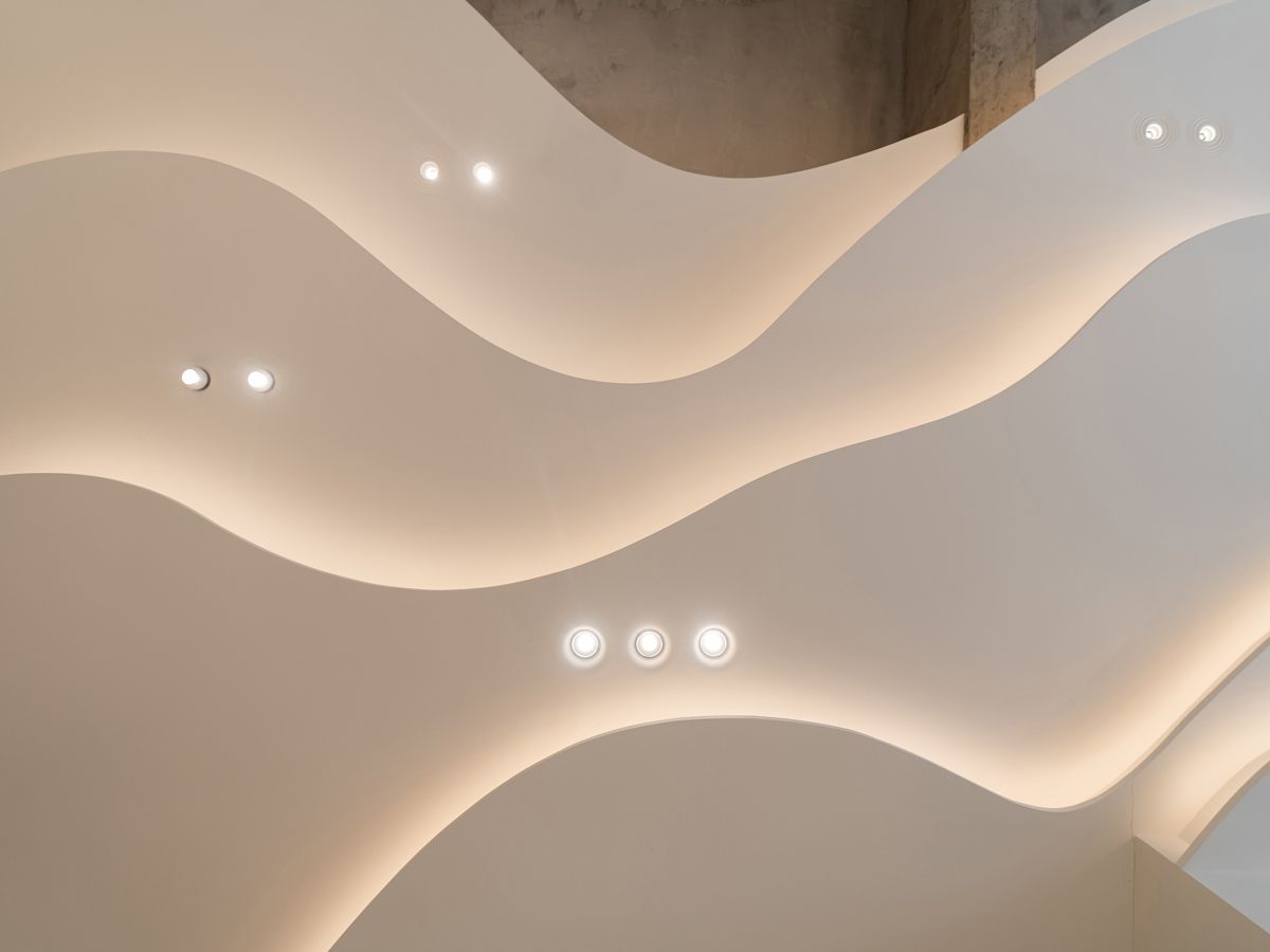 This layered ceiling at the Sol Luminaire Gallery