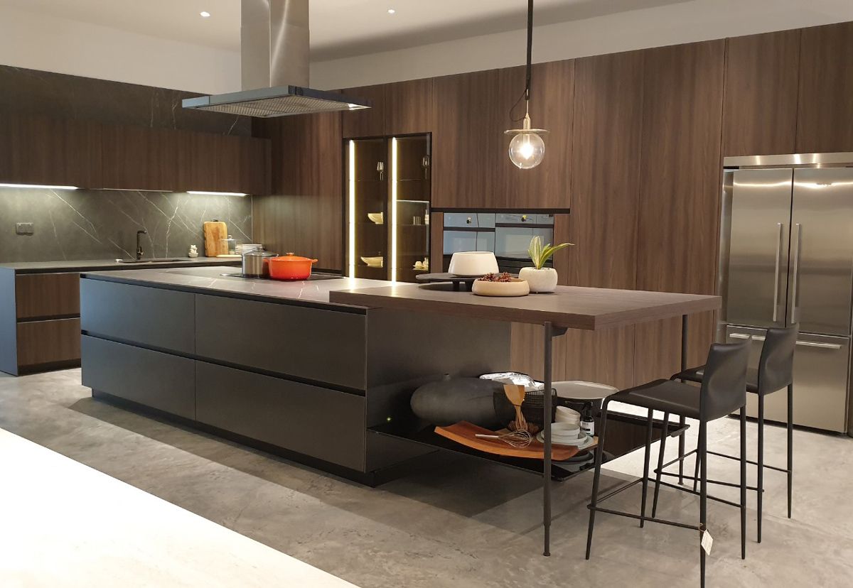 An Arrital kitchen island with attached breakfast counter