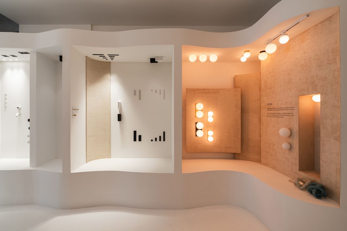 The architectural lightings at Sol Luminaire are displayed inside curvy white niches