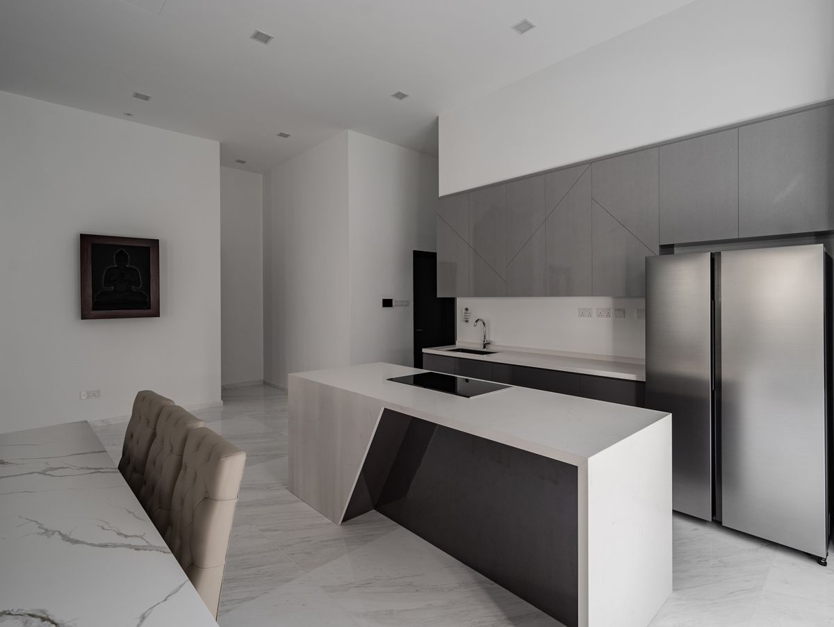 The angular form of the kitchen island creates a striking centrepiece in the culinary zone