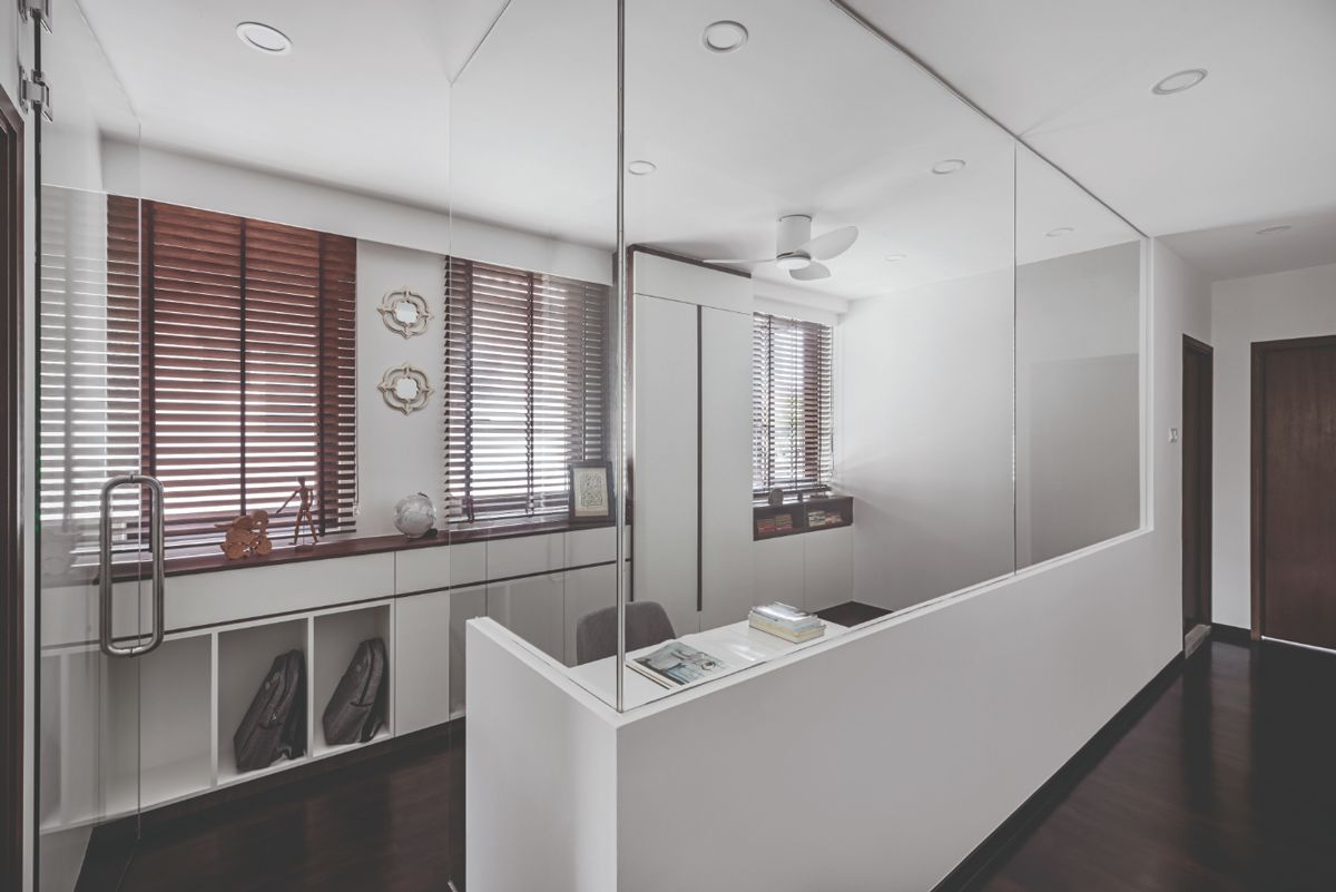 A glass partition makes the hallway feel more airy and spacious