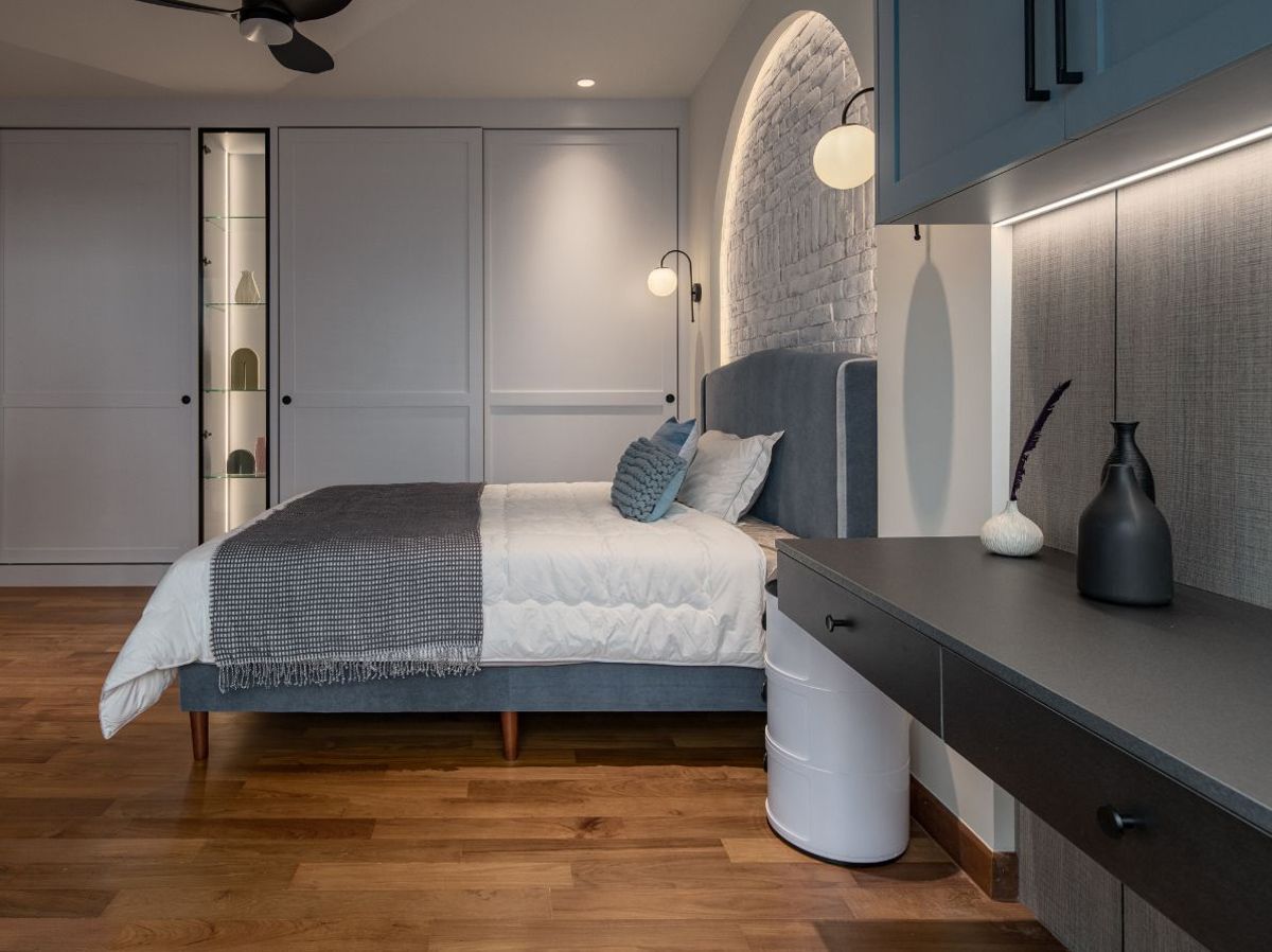 The bedroom is dressed in a soothing blue colour scheme