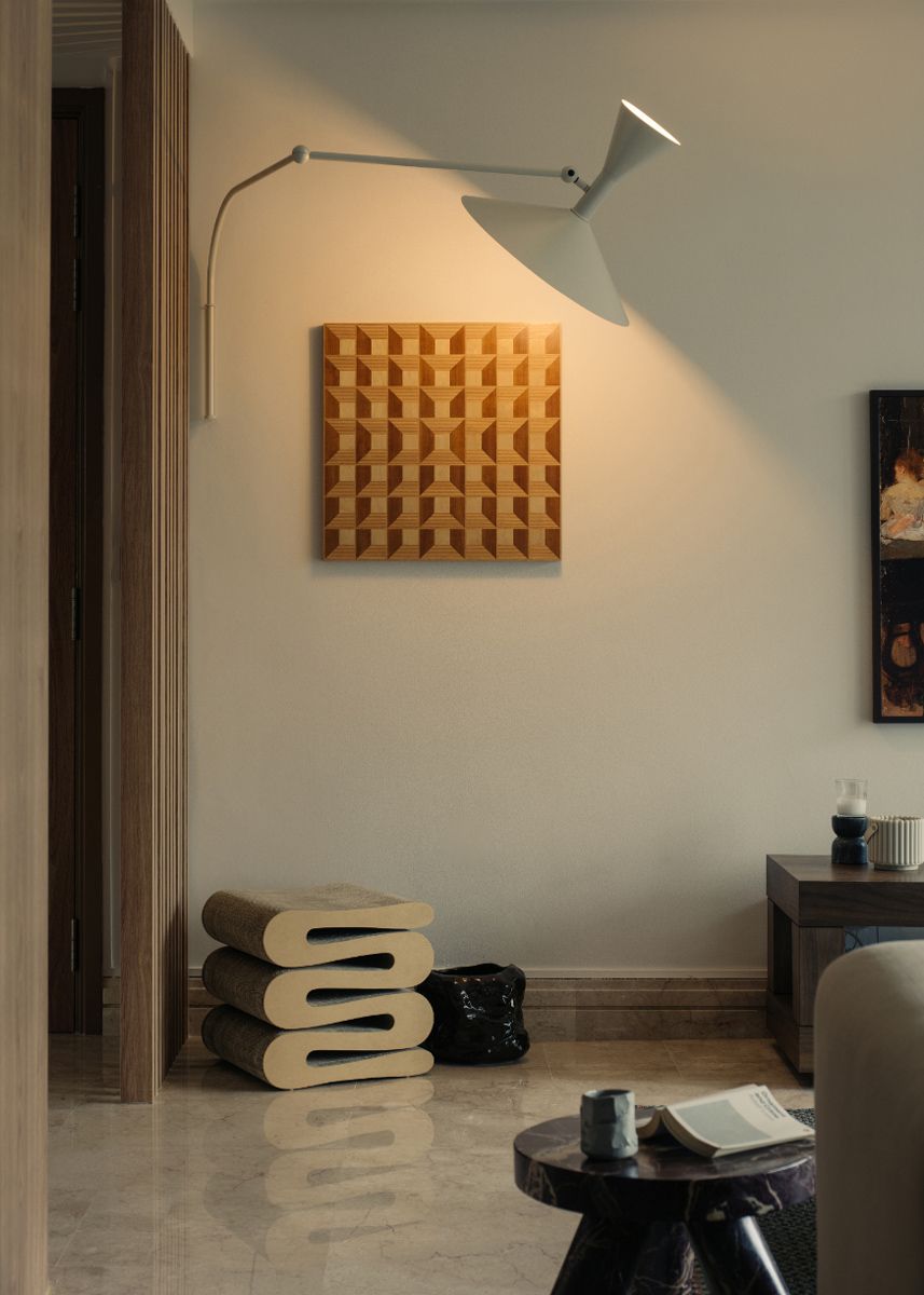 Lampe de Marseille wall lamp from Nemo Lighting highlights an art piece in the living area