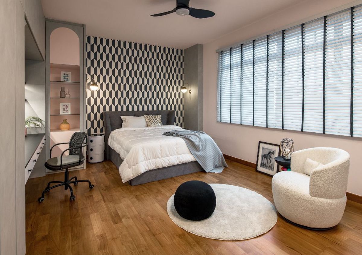 The abstract wallpaper enlivens the look of this bedroom