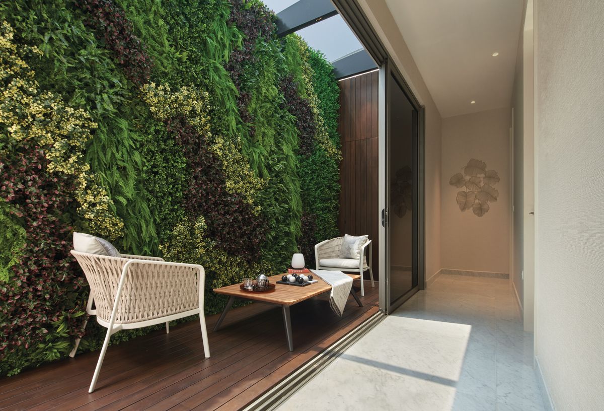 This enclosed terrace area provides a pocket of greenery within the home