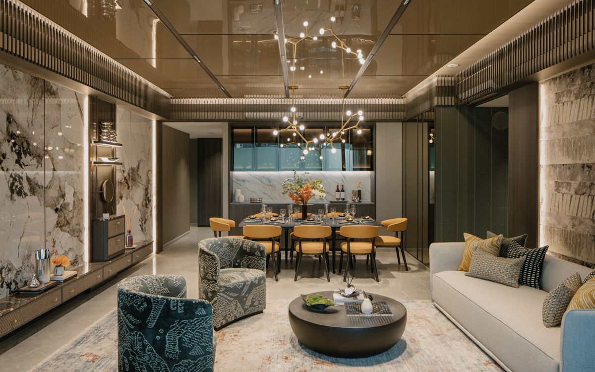 The show unit’s living and dining zones pull together various materials and finishes for a harmonious, calm aesthetic