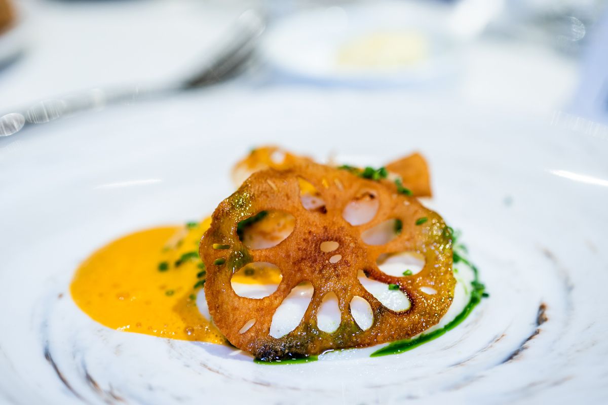 The second appetiser comprised pan-seared Hokkaido scallop, cauliflower, lobster bisque foam parsley oil, lotus root chip