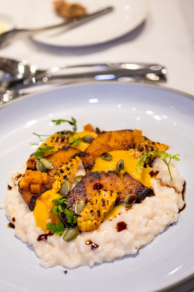 The pumpkin risotto with pickled pumpkin, pumpkin seed oil, roast pumpkin seeds and nasturtium leaves