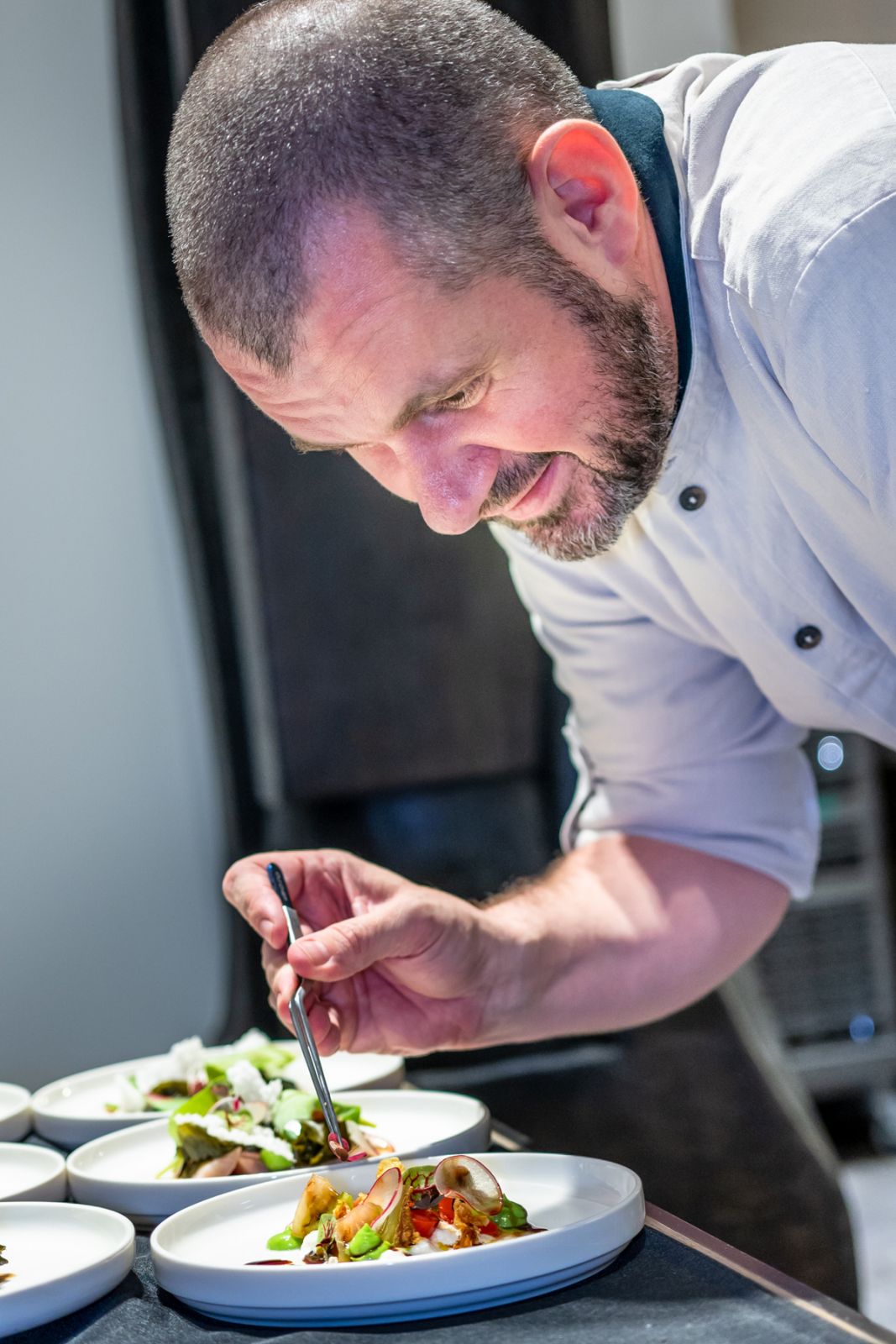 Chef Stephan Zoisl plating the main course