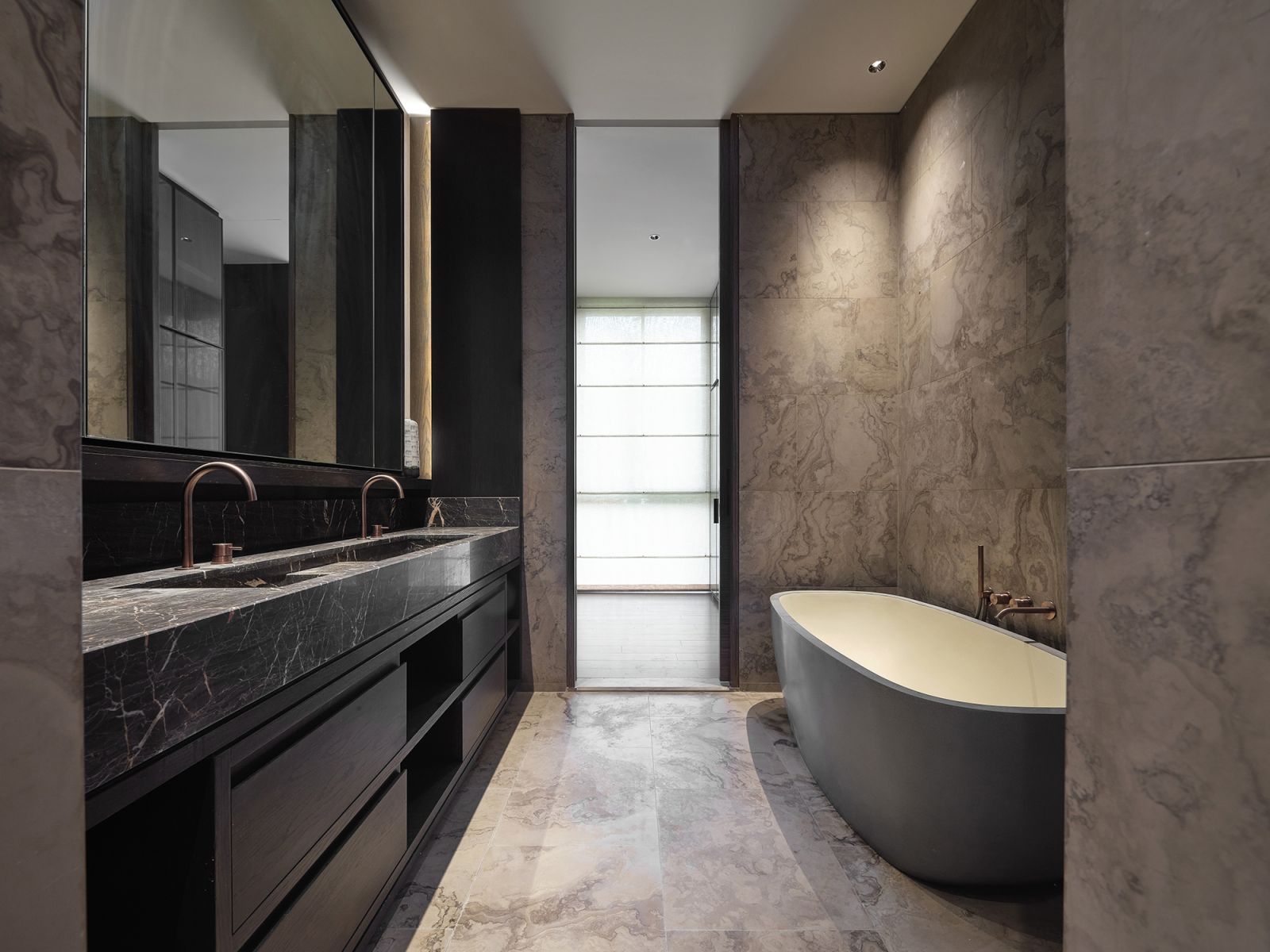 The original developer-issued bathroom makes a bold statement with dark finishes