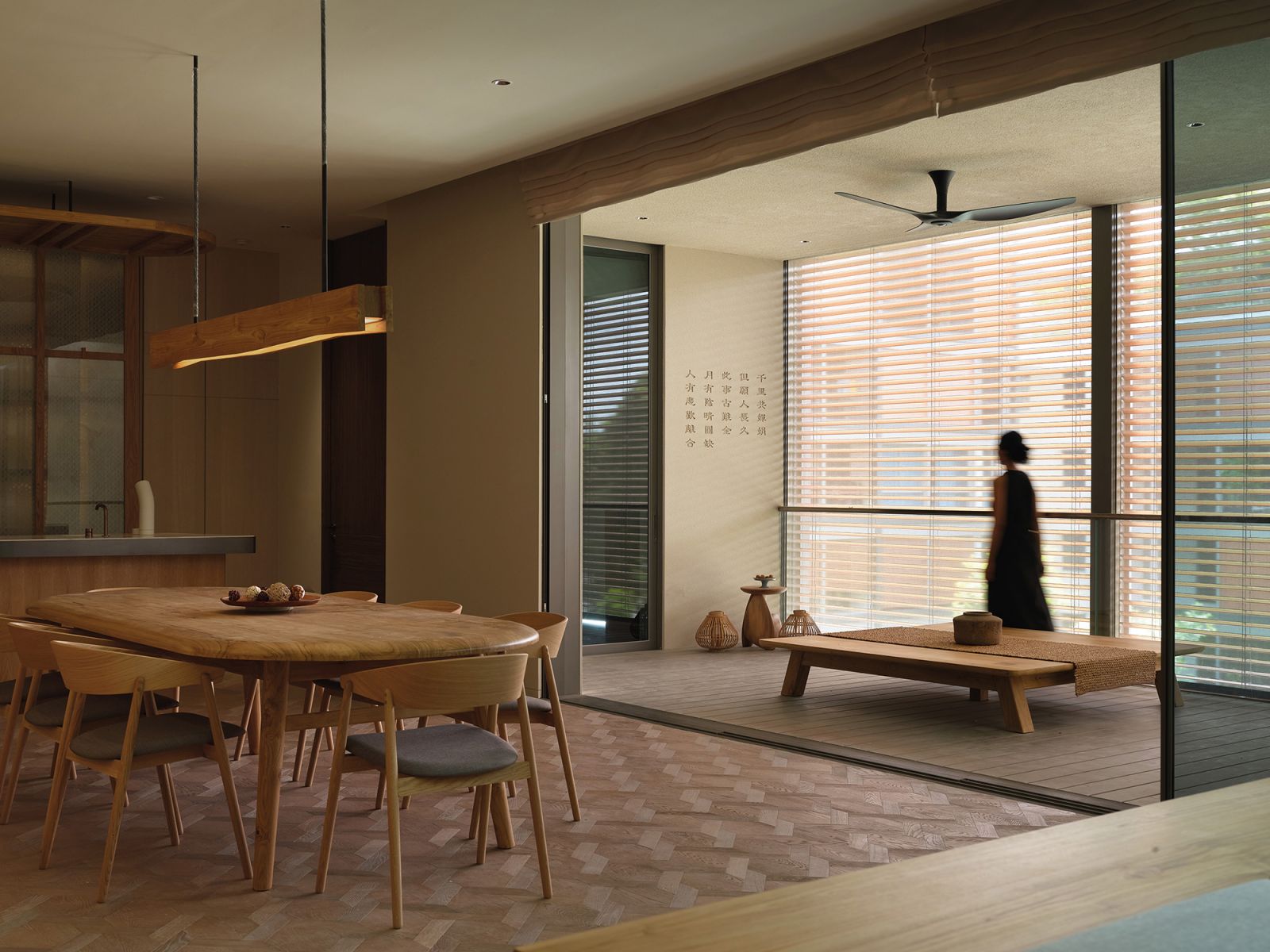Featuring a pyung sang low table seat and a wall adorned with words from the client’s favourite Chinese poem, the balcony is a cosy extension of the dining room and bar area