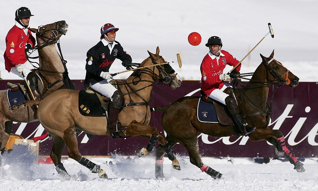 ST. MORITZ, SWITZERLAND - JANUARY 28: Jose Donoso (R) of Team Cartier and Eduardo Novillo Astrada (C) in action during the Team Cartier vs Team Brioni match for the Cartier Trophy during the 23rd Cartier Polo World Cup on Snow on January 28, 2007 in St. Moritz, Switzerland. The Cartier Polo World Cup on Snow is the world's most prestigious winter polo tournament. Four high-goal teams with handicaps of between 20 and 22 goals are battling for the coveted Cartier Trophy on the frozen surface of Lake St. Mori