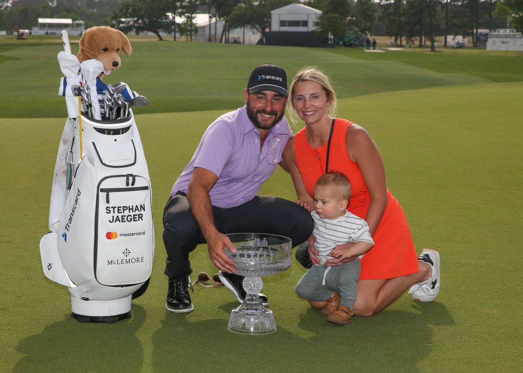 HOUSTON, TX - MARCH 31: Tournament winner Stephan Jaeger (GER), wife Shelby and son Fritz pose with trophy during the final round of the PGA Texas Children's Houston Open at Memorial Park Golf Course on March 31, 2024 in Houston, Texas. (Photo by Leslie Plaza Johnson/Icon Sportswire via Getty Images)
