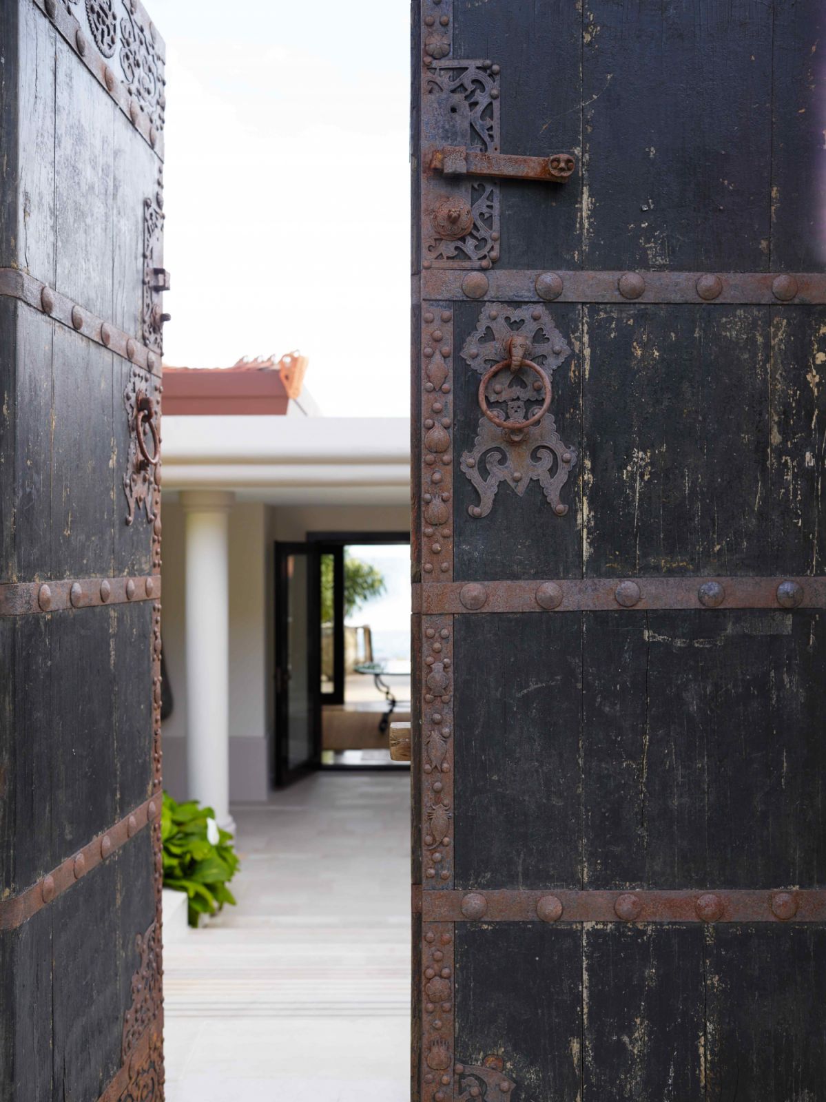 The antique front door with a Thai aesthetic