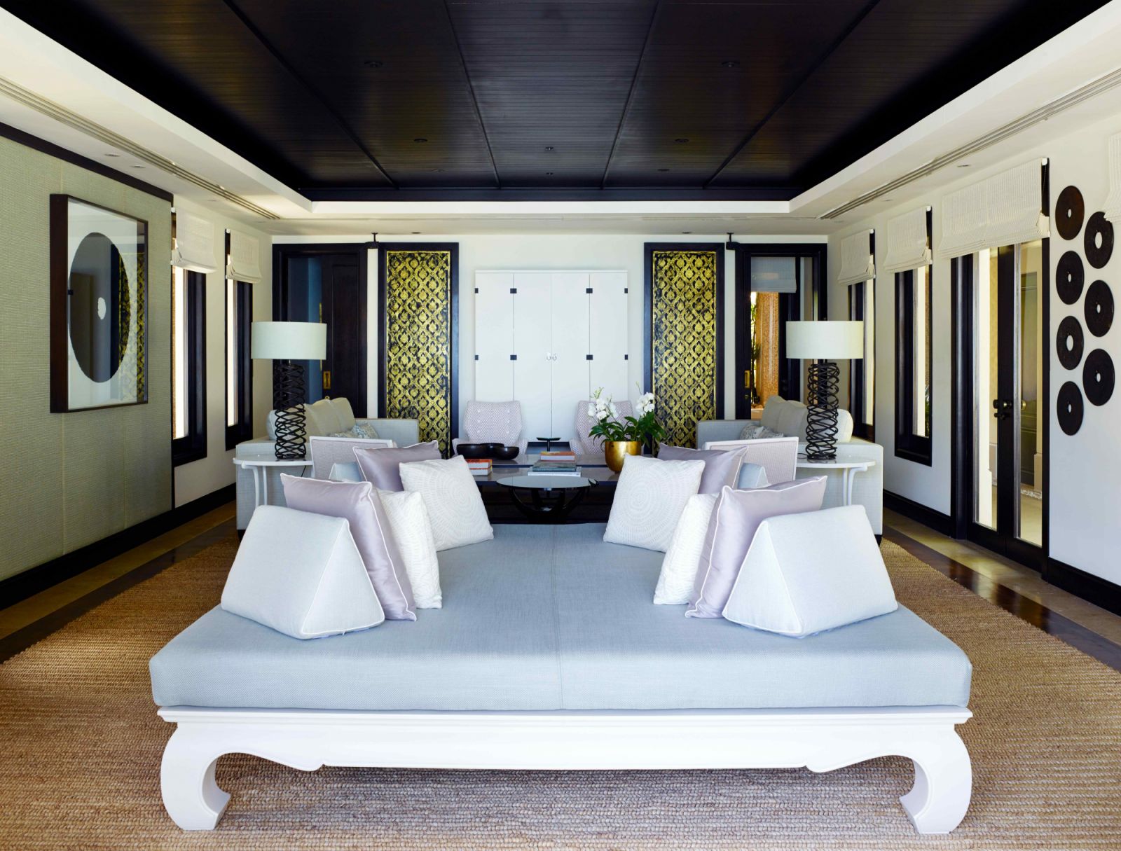 The lower sala or living room with a fabric-panelled wall and antique furnishing