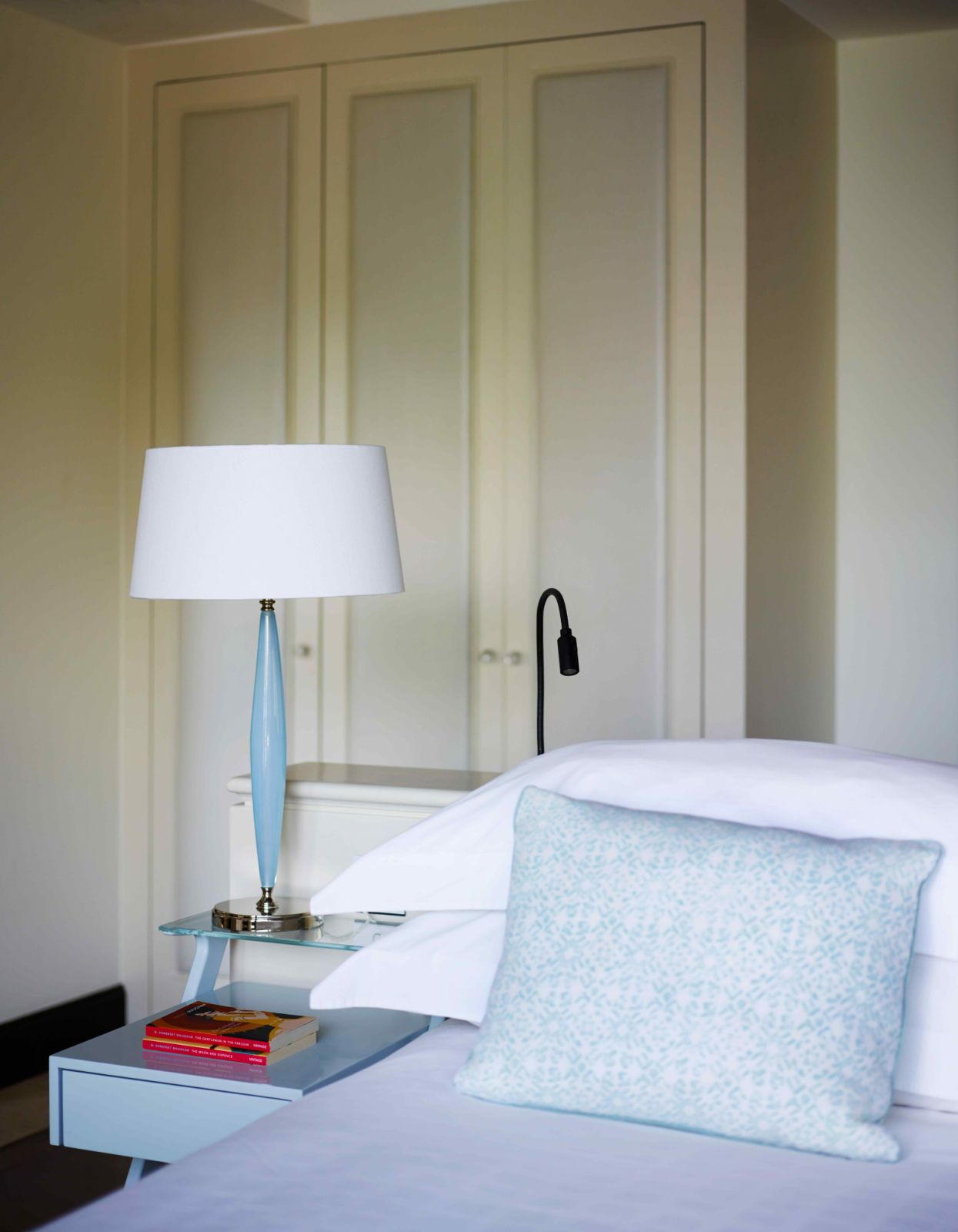 Green and blue tones uplift the off-white base