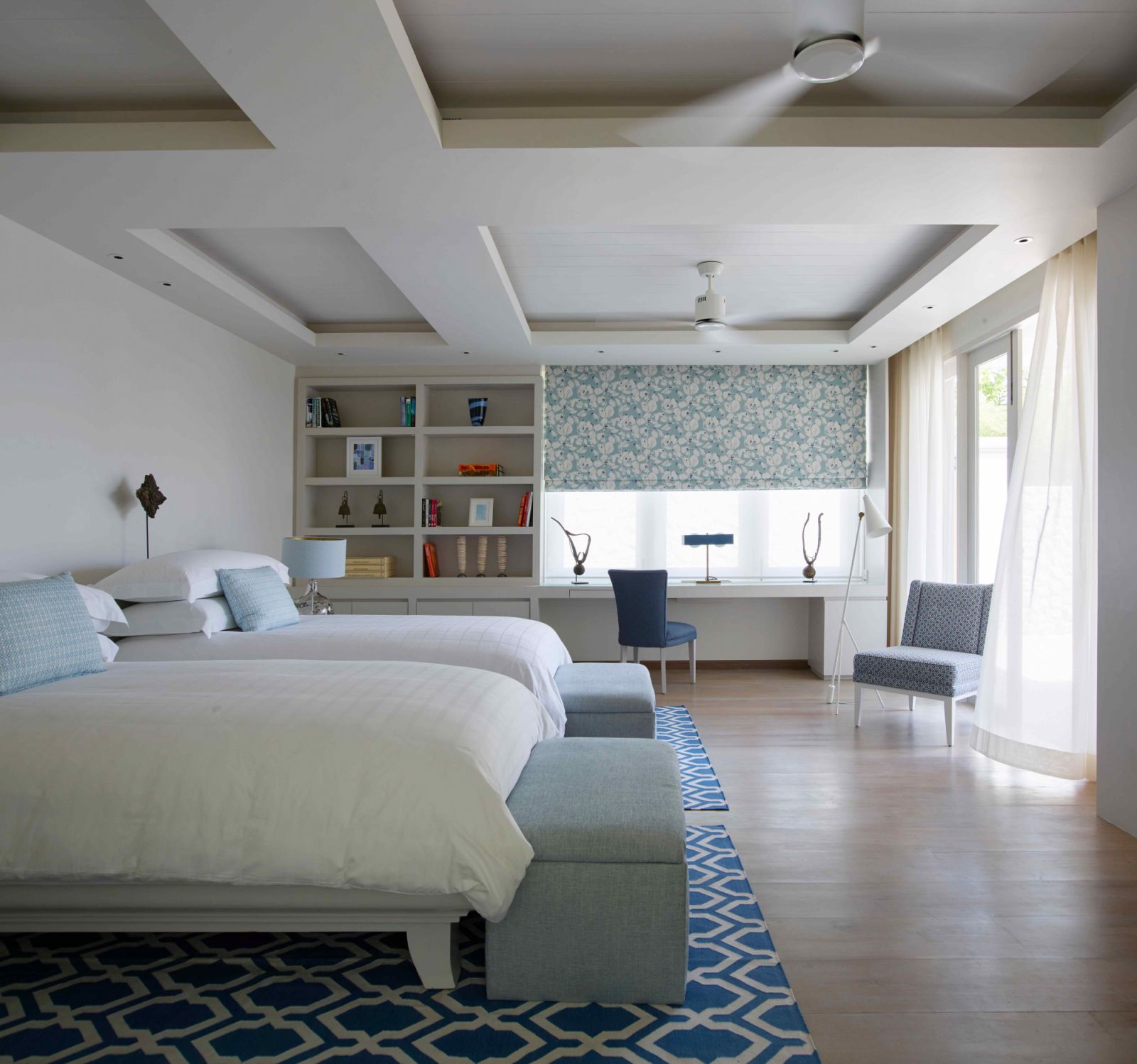 One of the bedrooms with a light and airy colour palette