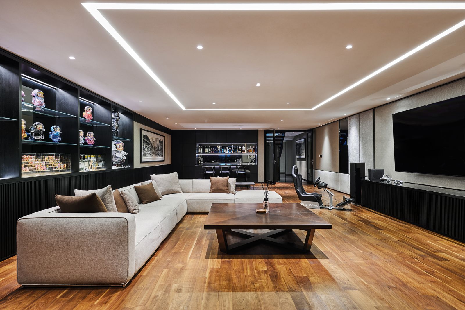 The media room in the basement has its own whiskey bar
