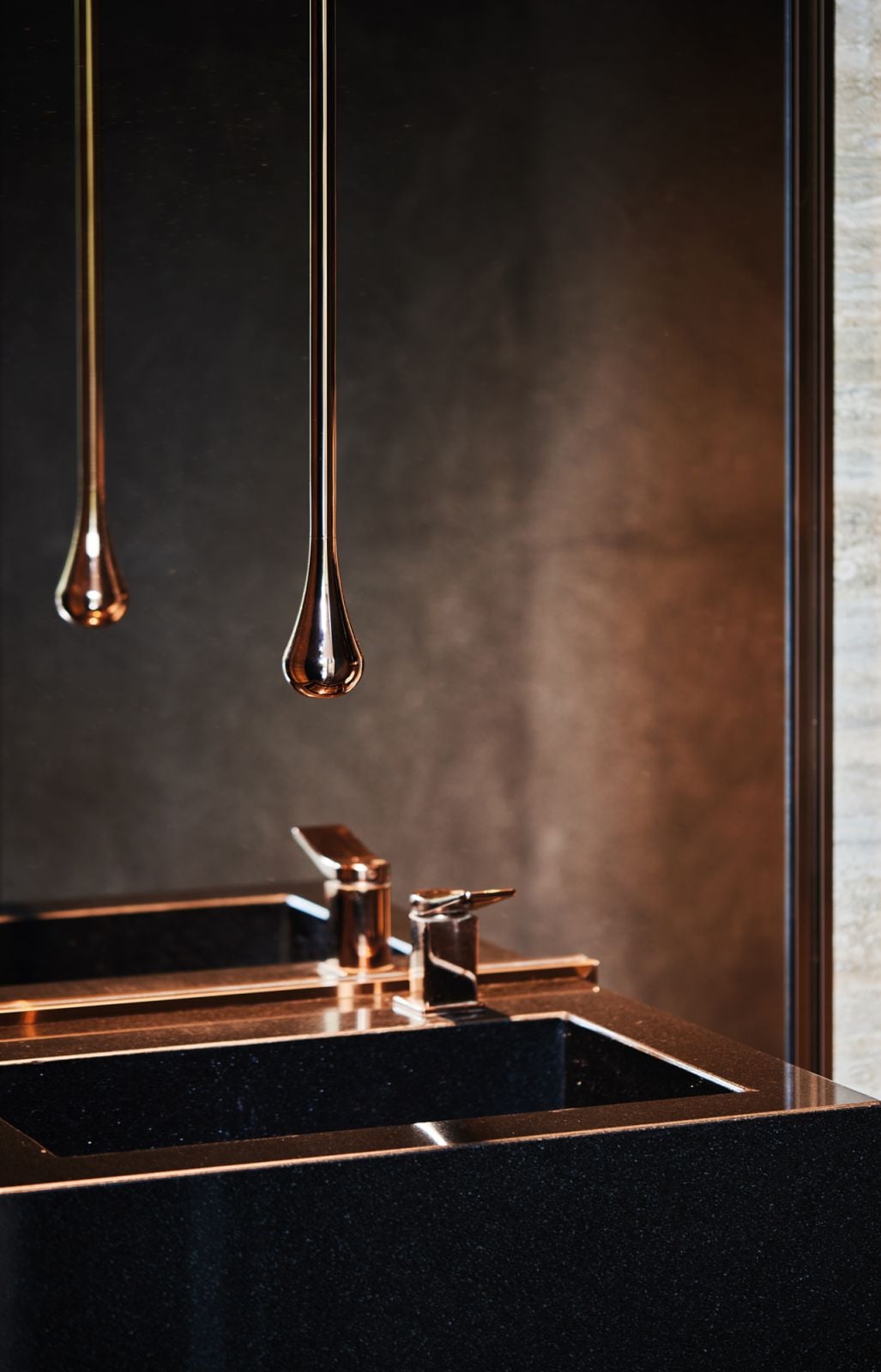 The custom Gessi ceiling spout in the powder room is a work of art in itself