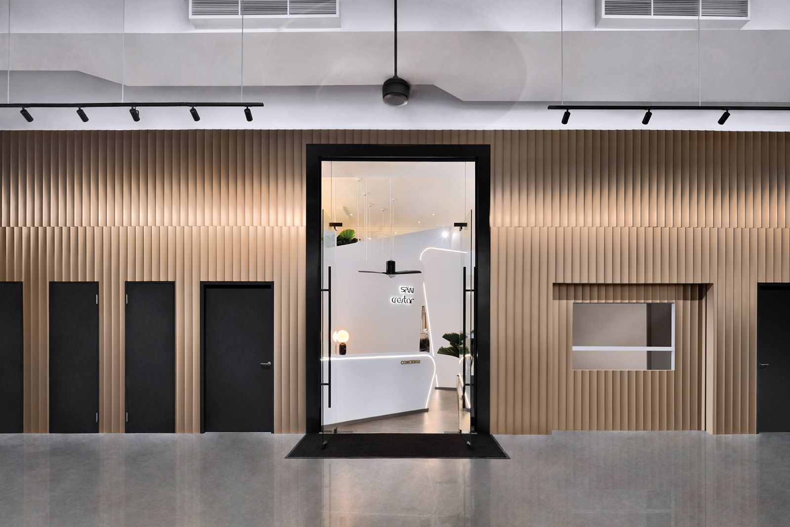 Fluted bronze panels add a touch of glamour to the entrance