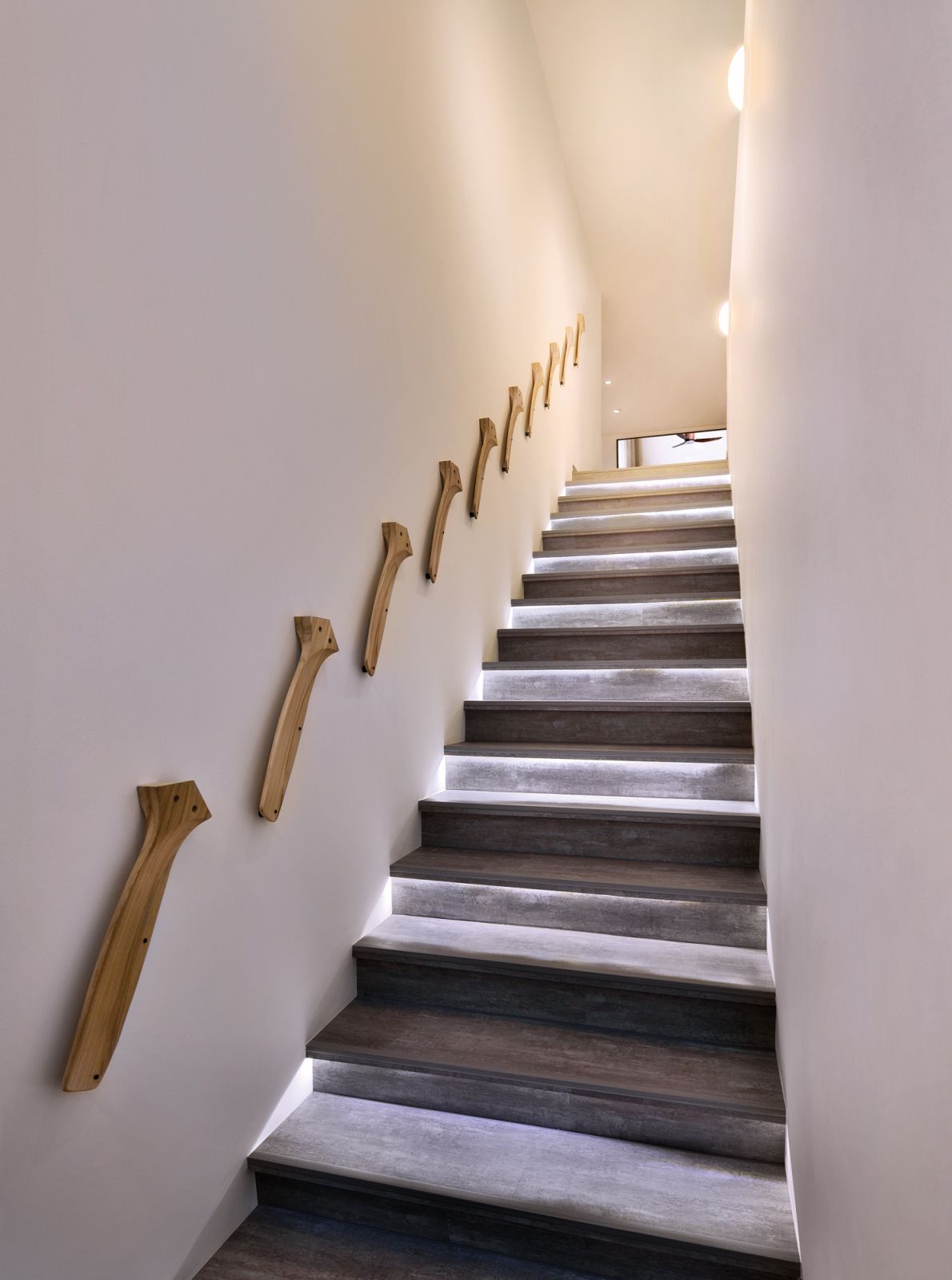 Fan blades are cleverly utilised as staircase handrails
