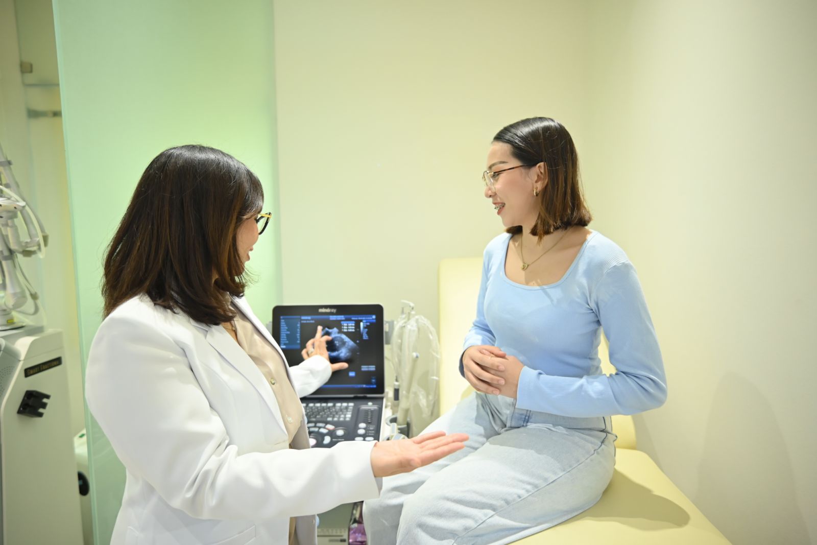 Dr Jaycy Violago-Olivarez and a patient at one of their clinics