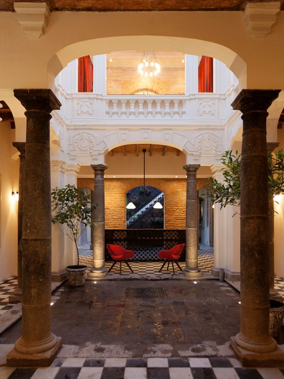 The central courtyard that serves as an open lobby/reception area