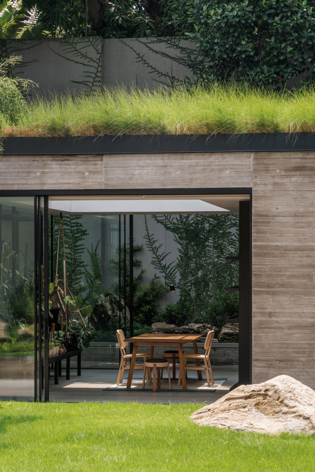 The sunroom’s green roof and skylight foster a sense of intimacy with nature