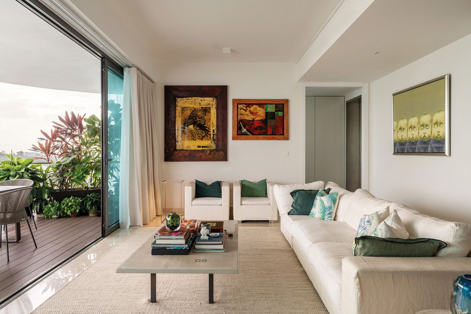 Large glass panes blur the line between the interior spaces and the breezy outdoor areas