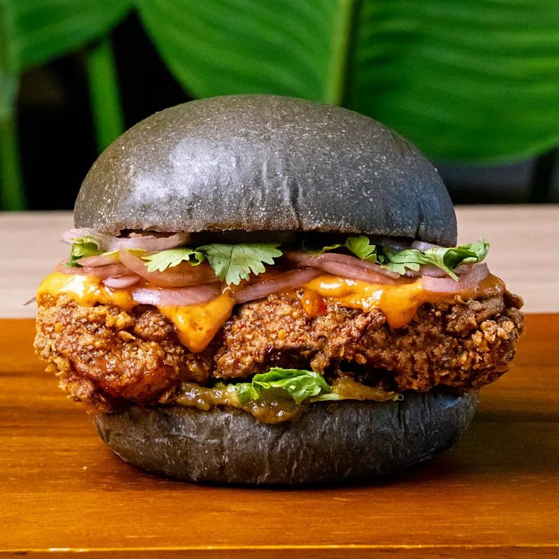 The Budu Budu burger with fried chicken thigh, asam boi sweet onions, shredded lettuce and Budu sauce (Photo: MyBurgerLab)