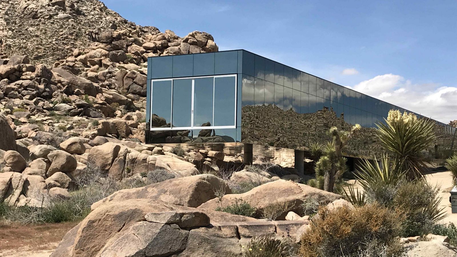 The Solarcool glass exterior that reflects the natural beauty of the surrounding desert landscape