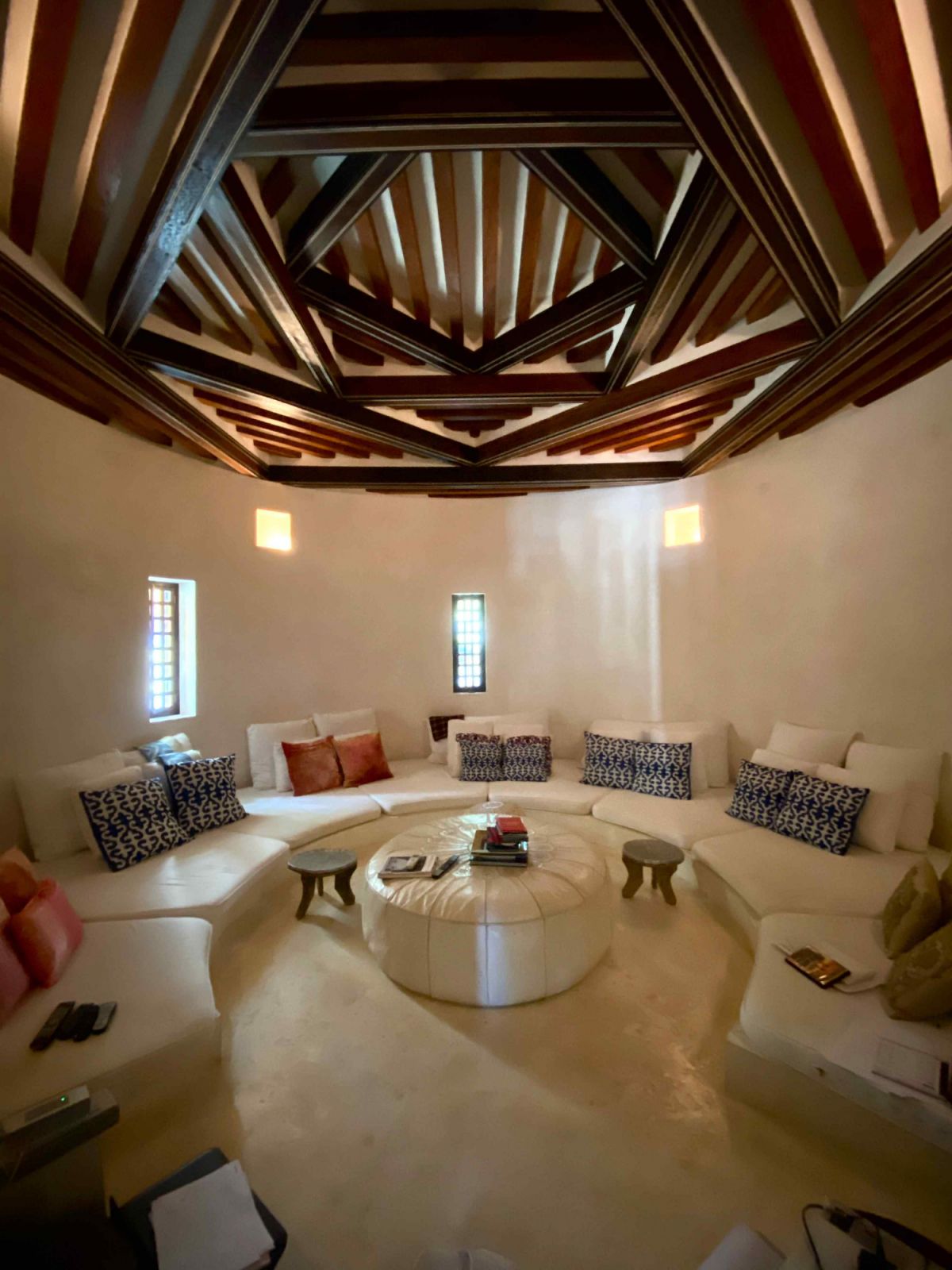 The indoor common area with a wood beam ceiling