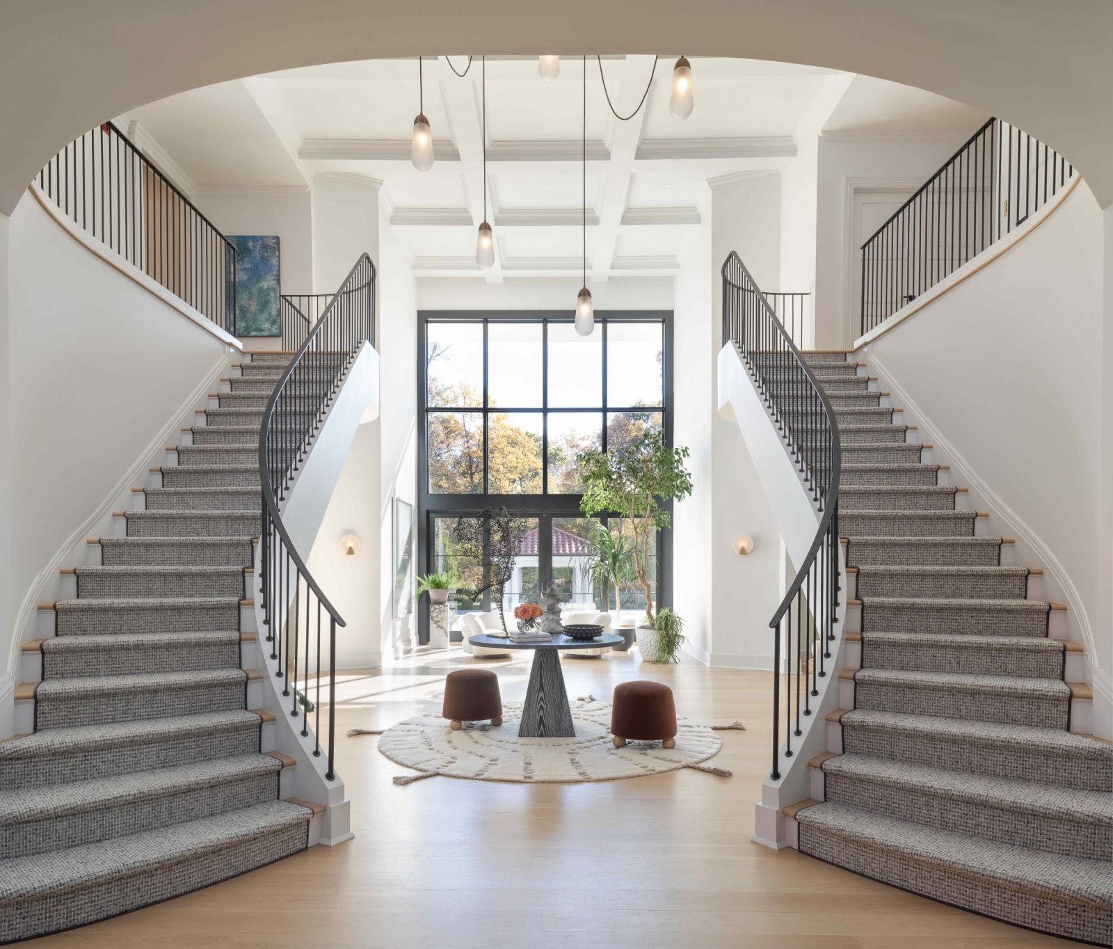 The streamlined grand staircases upon entry into the residence
