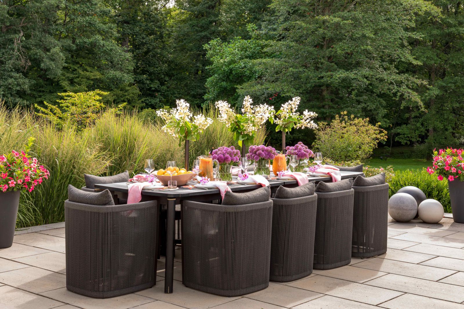 An outdoor dining area amidst the colourful garden