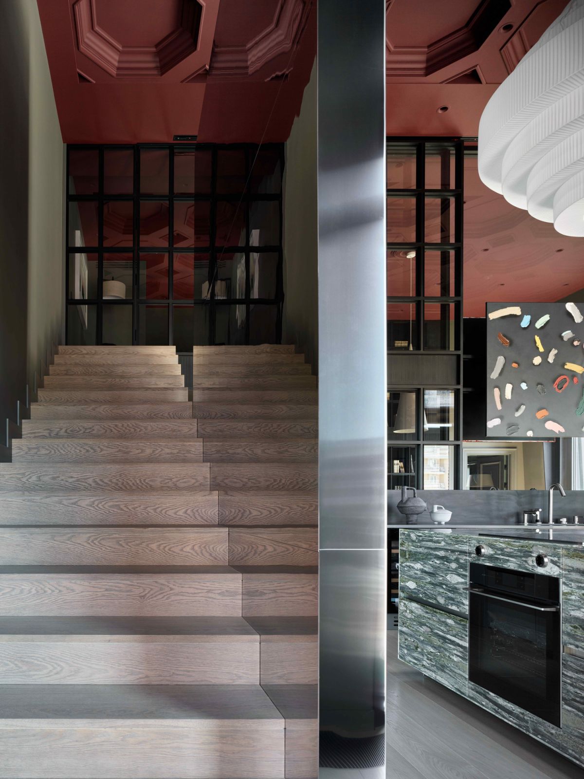 The staircase built into the apartment leads to the mezzanine level