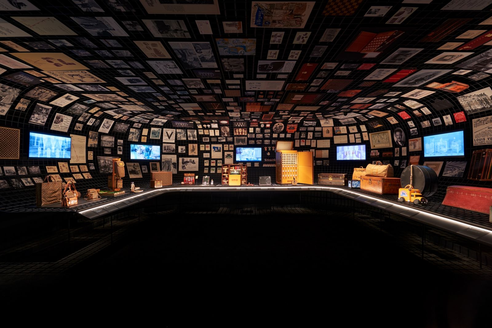 An exhibit of archival documents, compiling the history of Louis Vuitton into a visual narrative