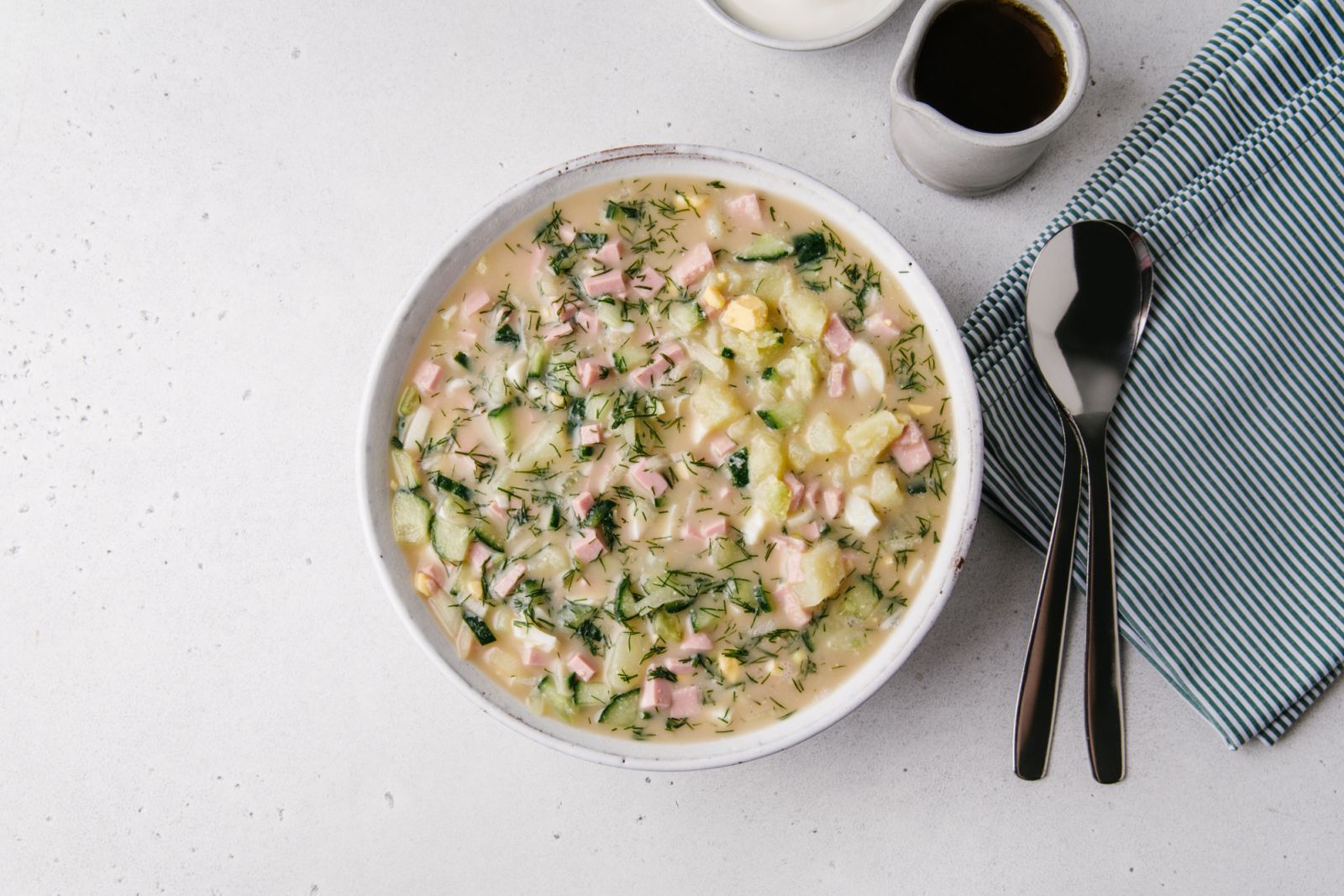 Summer cold soup with vegetables. Cold traditional Russian and Ukraine Soup Okroshka. Vitamin meal with kvass. Summer refreshing food.