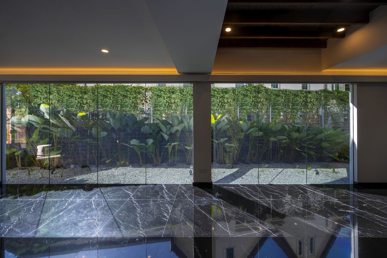 View of the garden from the light-filled, minimalist interior space (Photo: Lin Ho)