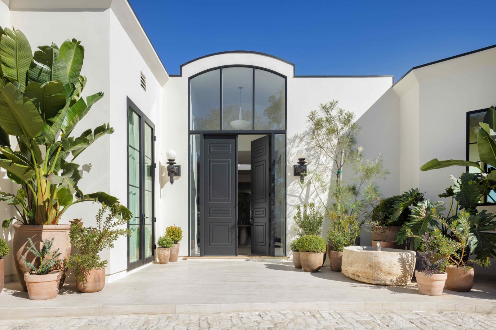 A limestone hardscape façade and Woolf-inspired Pullman doors
