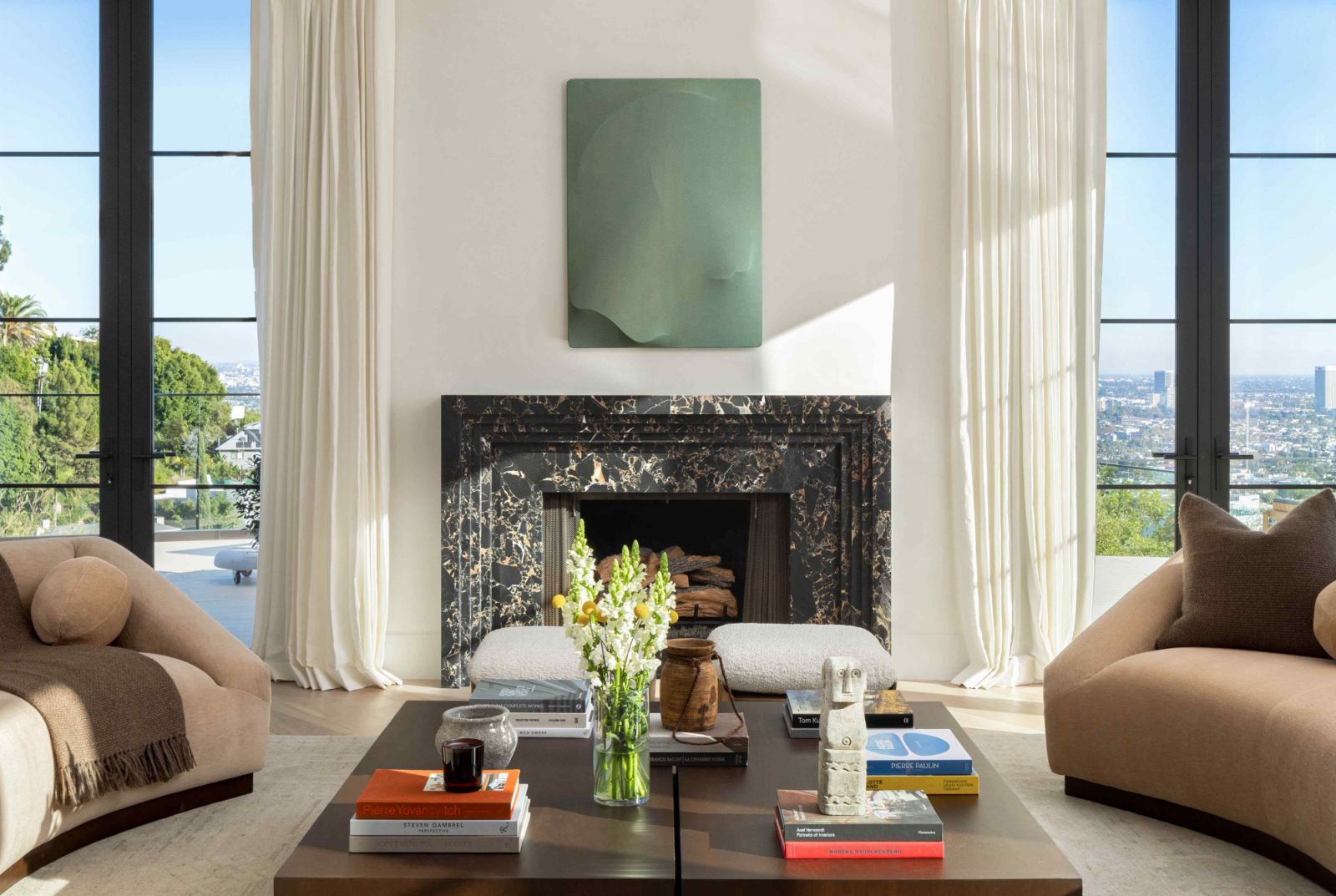 The Chanel Nior marble fireplace enhances the space with luxurious appeal