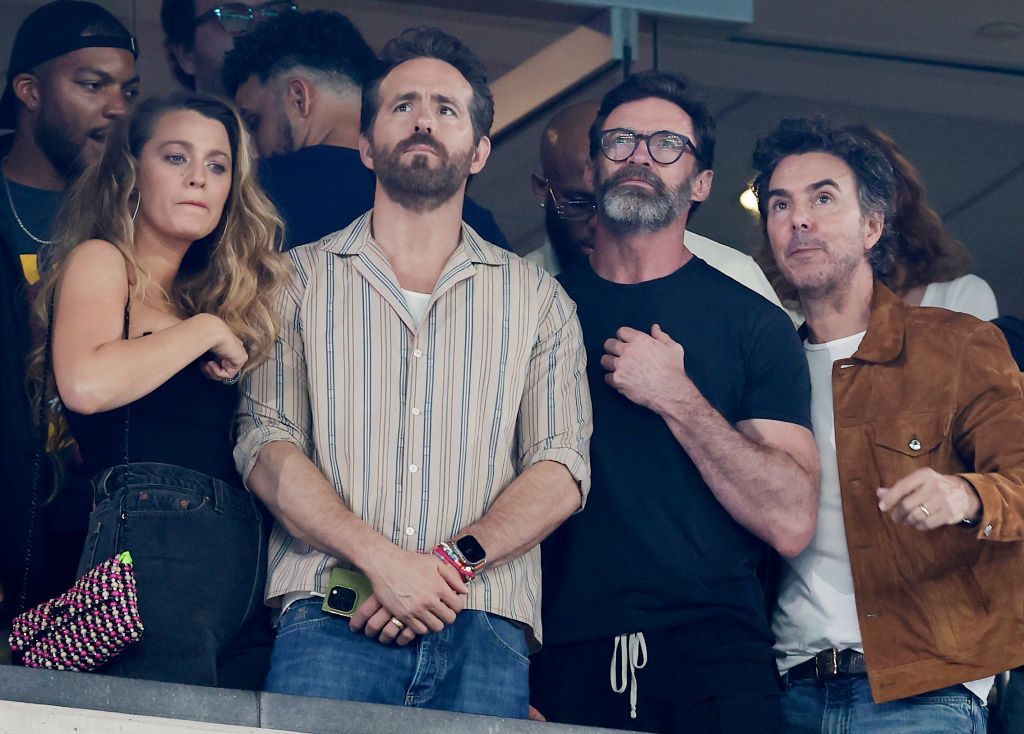 Actress Blake Lively and actors Ryan Reynolds and Hugh Jackman attend a game between the New York Jets and the Kansas City Chiefs at MetLife Stadium on October 01, 2023 in East Rutherford, New Jersey. The Chiefs defeated the Jets 23-20. (Photo by Jim McIsaac/Getty Images)