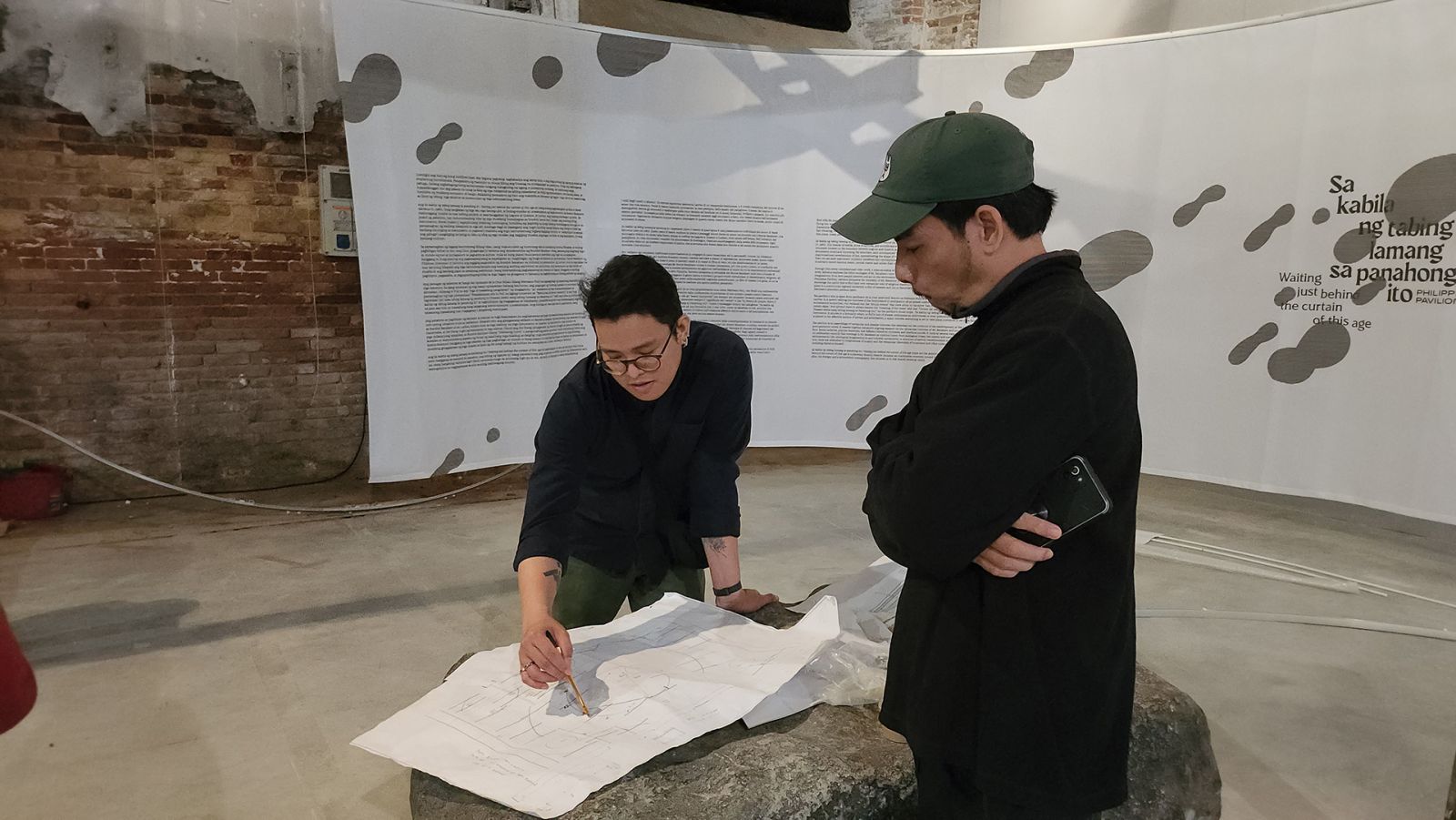 Curator Carlos Quijon, Jr and artist Mark Salvatus during the Installation and set-up of ‘Sa kabila ng tabing lamang sa panahong ito’ (‘Waiting just behind the curtain of this age’) (Photo: Ian Kenneth Gines / Courtesy of NCCA - PAVB)