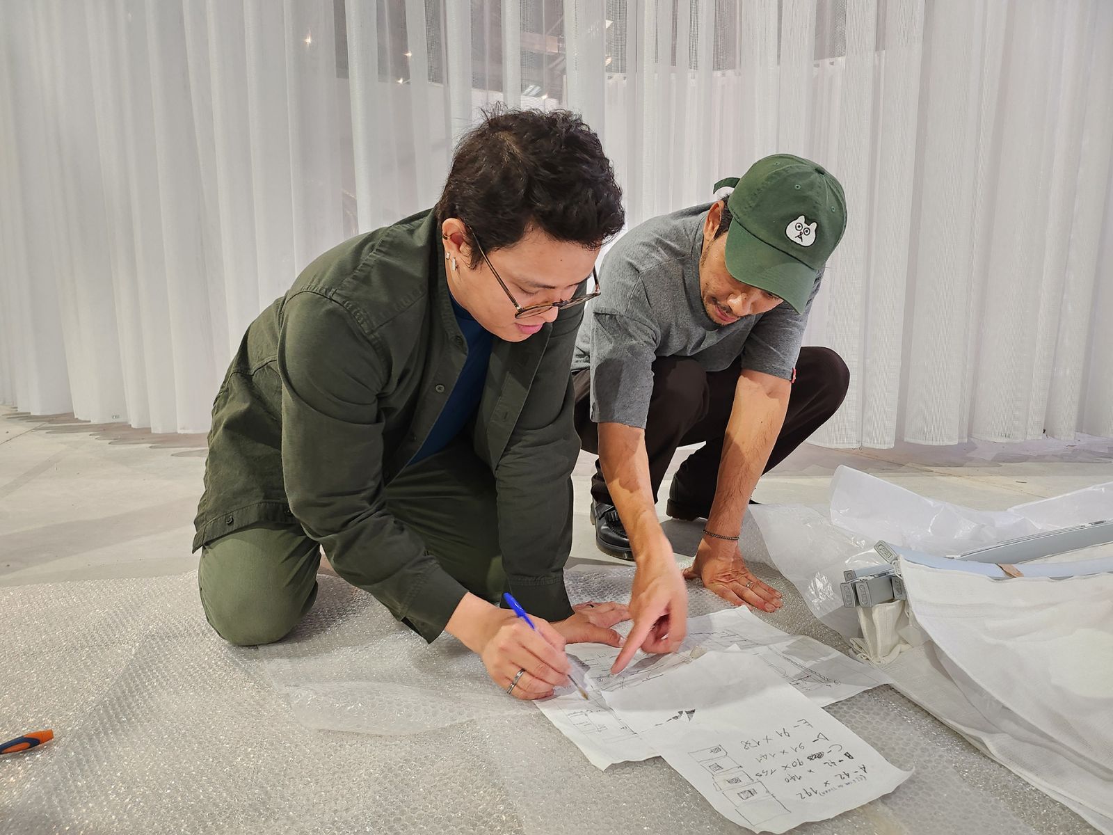 Curator Carlos Quijon, Jr and artist Mark Salvatus during the Installation and set-up of ‘Sa kabila ng tabing lamang sa panahong ito’ (‘Waiting just behind the curtain of this age’) (Photo: Ian Kenneth Gines / Courtesy of NCCA - PAVB)