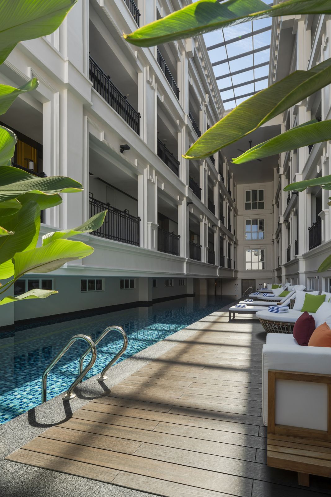 The central atrium bathes the pool with natural light